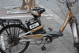 A photograph of a bicycle fitted with an electric motor